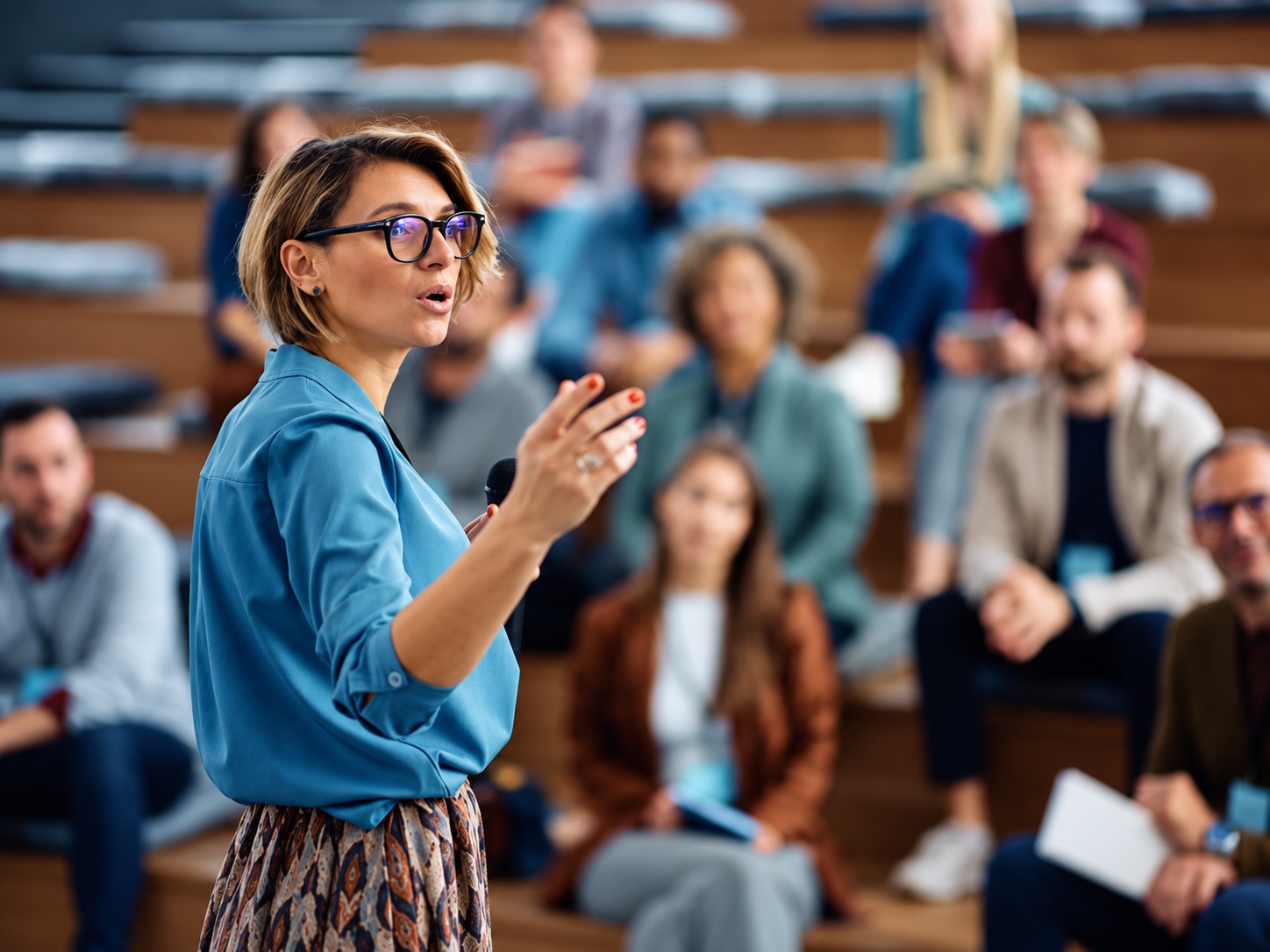 Female lecturer speaking to an audience